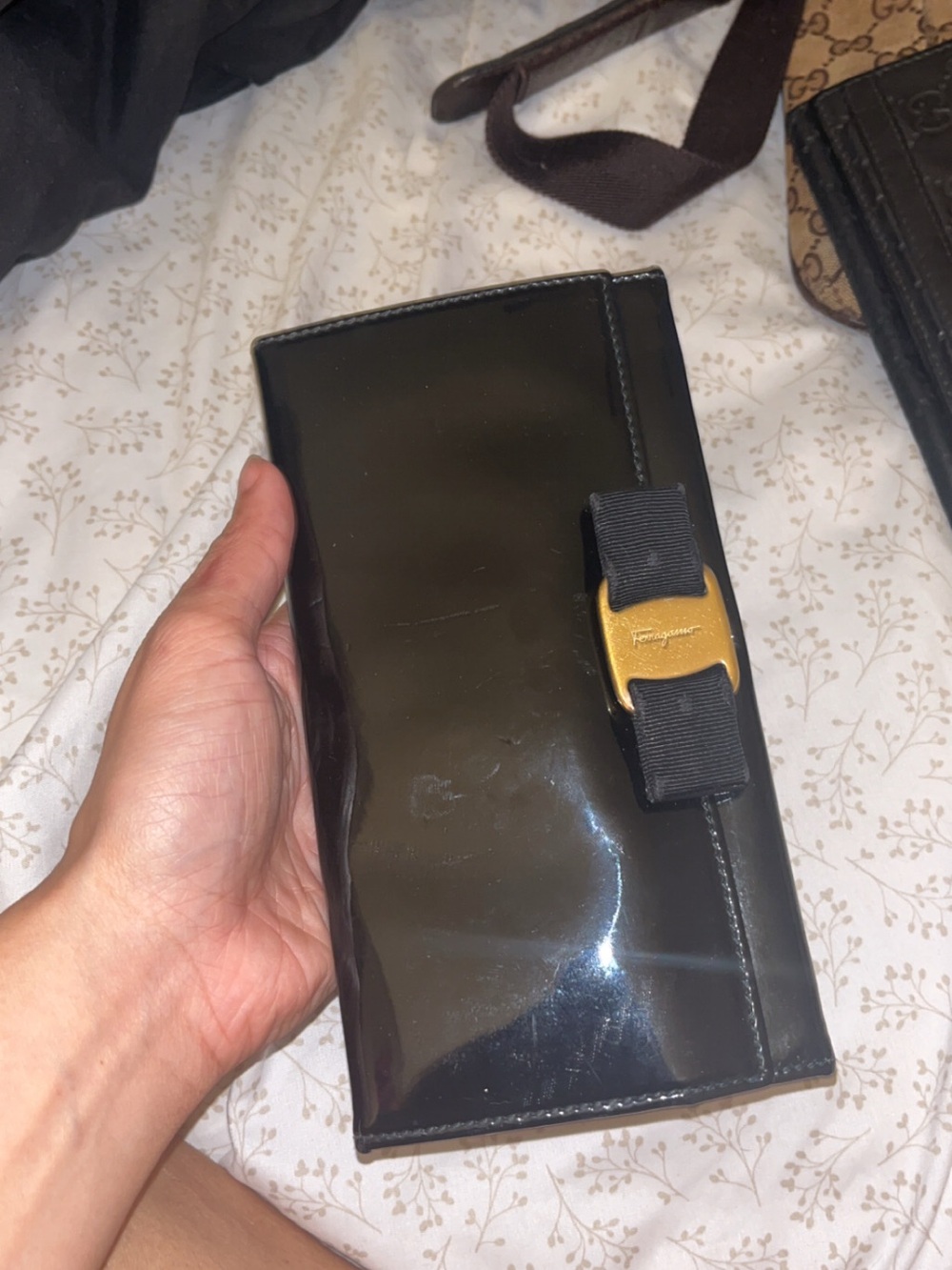 Salvatore Ferragamo Black Patent Leather Bow Wallet with Gold Buckle